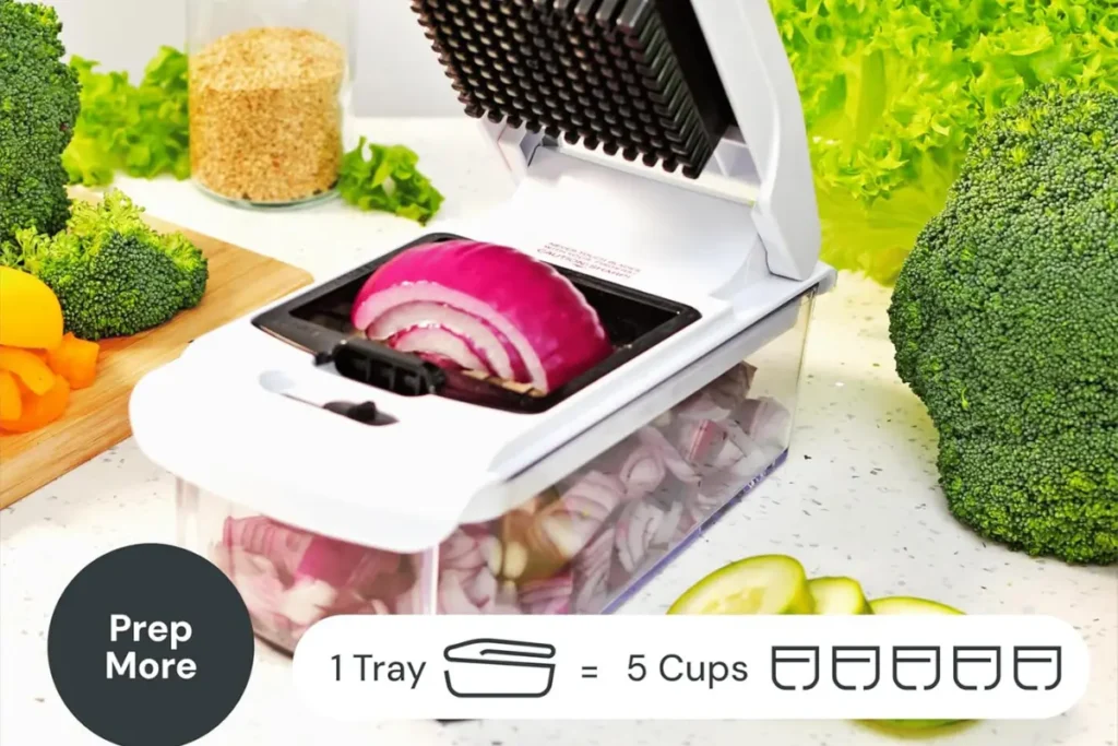 Fullstar Vegetable Chopper dicing onions into the transparent catch tray container.
